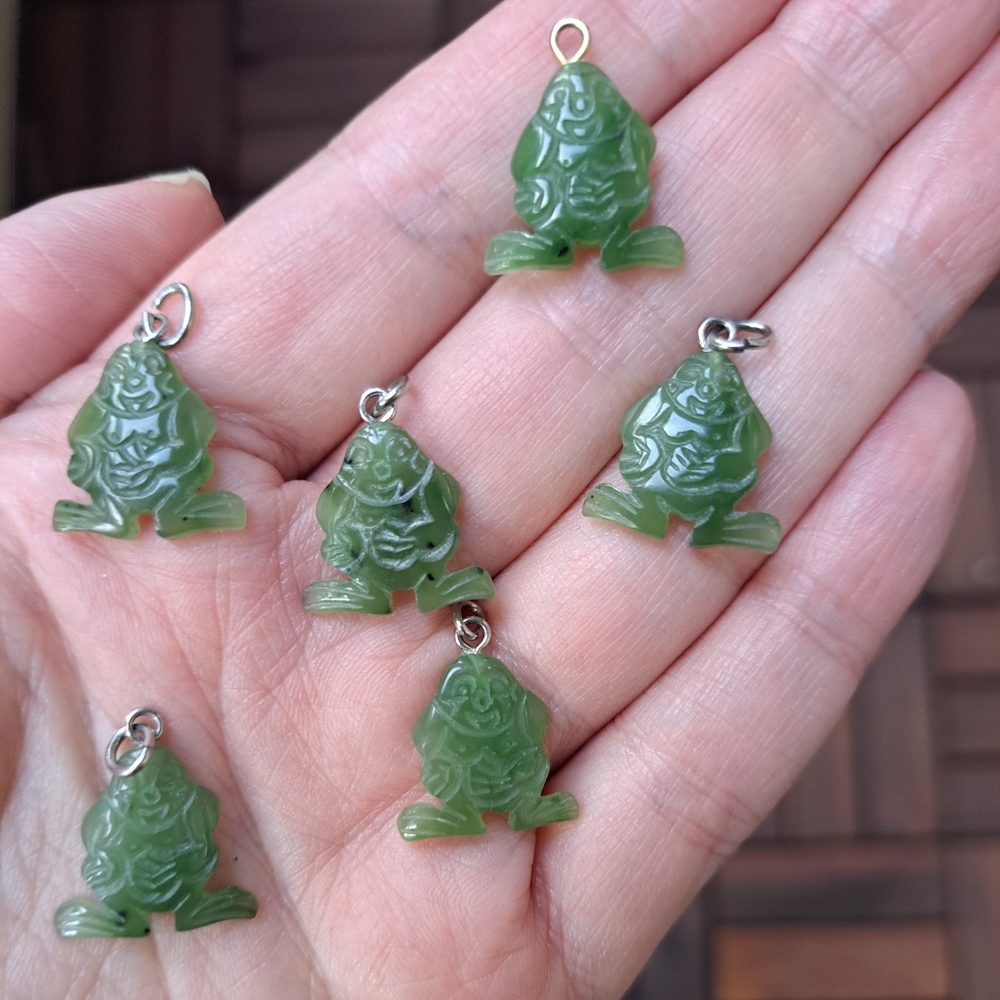 Six stylized Buddha type pendants